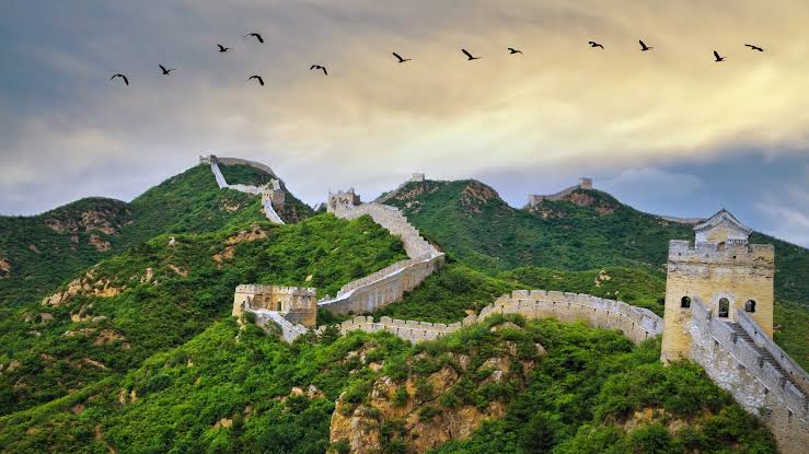Great Wall winding into misty hills